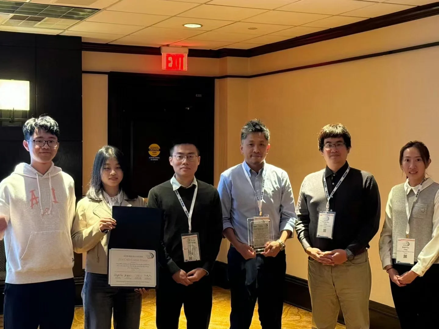 Team members holding certificates for Wuqian Tang's second-place team in the ICCAD 2024 CAD Contest Problem A.