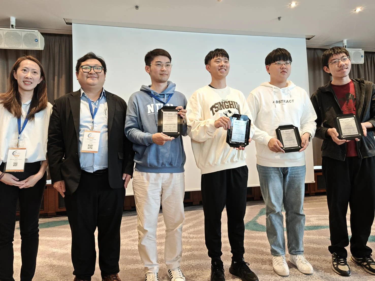 Team members holding second-place plaques for Wuqian Tang's team in the ICCAD 2025 CAD Contest Problem A.