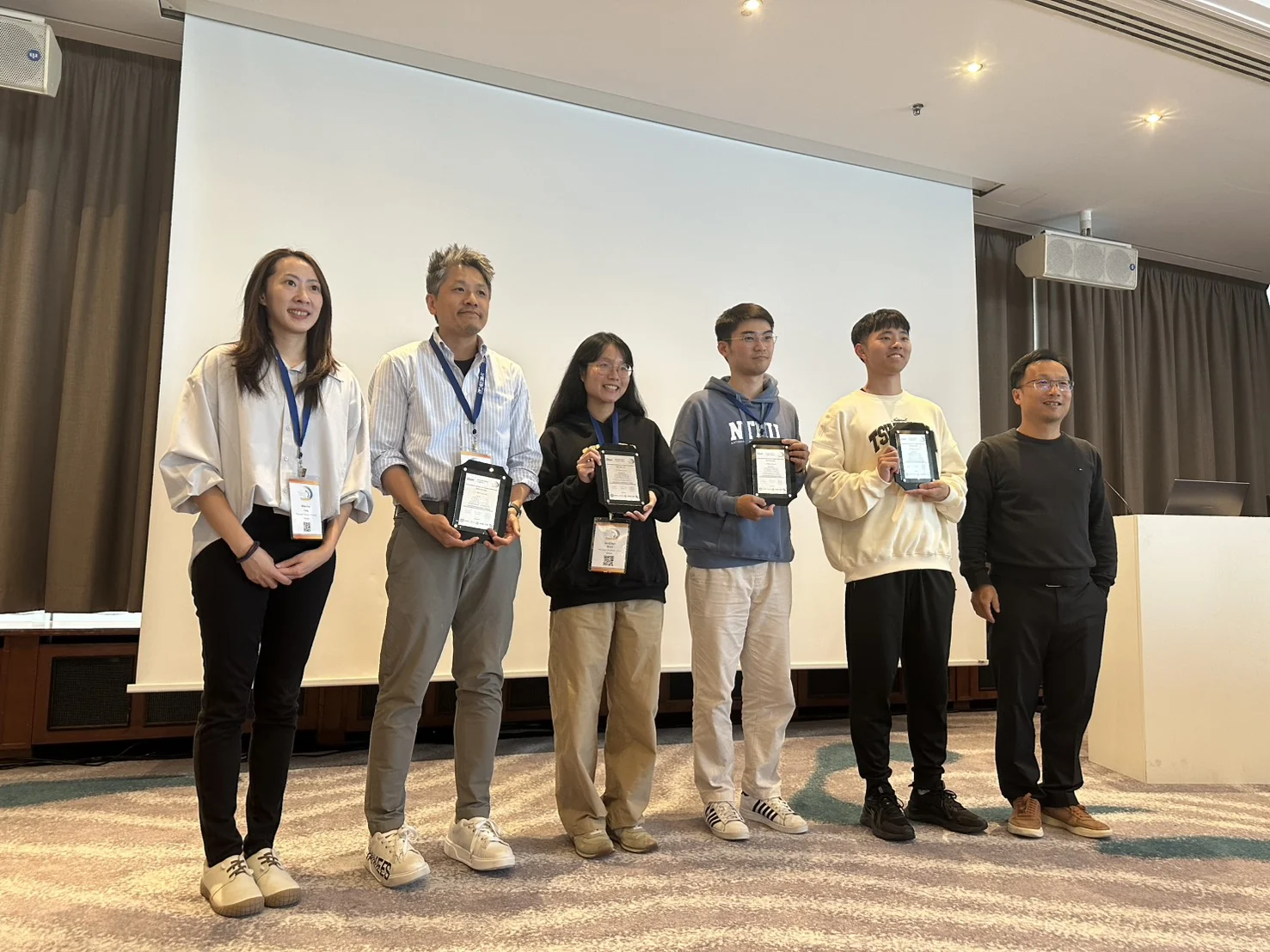 Award recipients holding plaques for Problem C at the ICCAD 2025 CAD Contest, won by Wuqian Tang's first-place team.